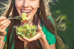 a person eating a salad