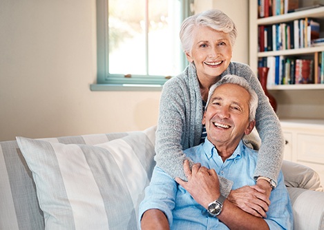 Romantic senior couple in living room