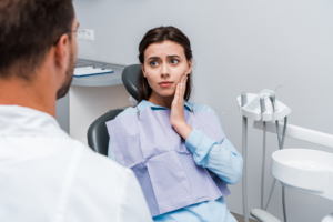 a dental patient chatting with their dentist