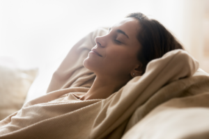 a patient resting at home following wisdom tooth extraction